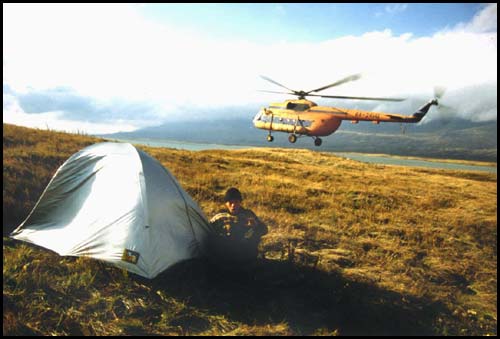 Jonathan holds my tent on the point to fly away. (Tuva Republic)